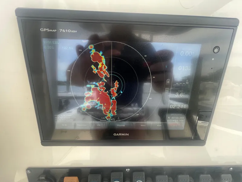 Slide: The Image of Garmin GPSMAP 7610xsv display on 2016 Sea Hunt Gamefish 27 boat, showing radar navigation. - 25