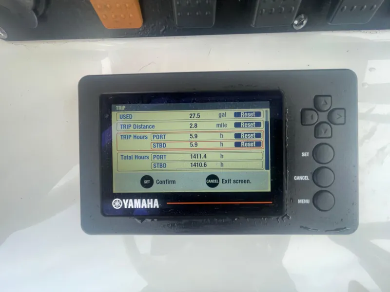 Slide: The Image of Yamaha display on 2016 Sea Hunt Gamefish 27 showing trip data and engine hours. - 30