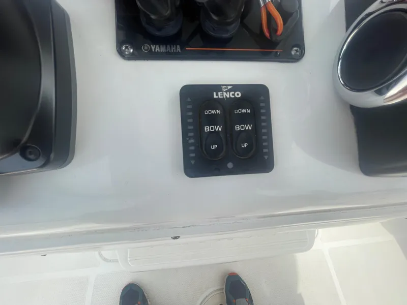 Slide: The Image of Control panel on a 2016 Sea Hunt Gamefish 27 boat with Lenco trim tab switches. - 33
