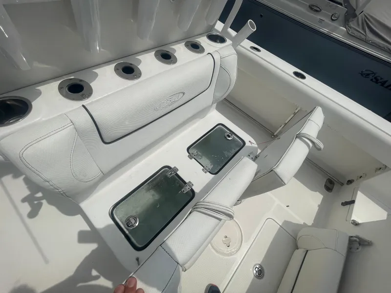 Slide: The Image of 2016 Sea Hunt Gamefish 27 boat interior with rod holders and storage compartments. - 40