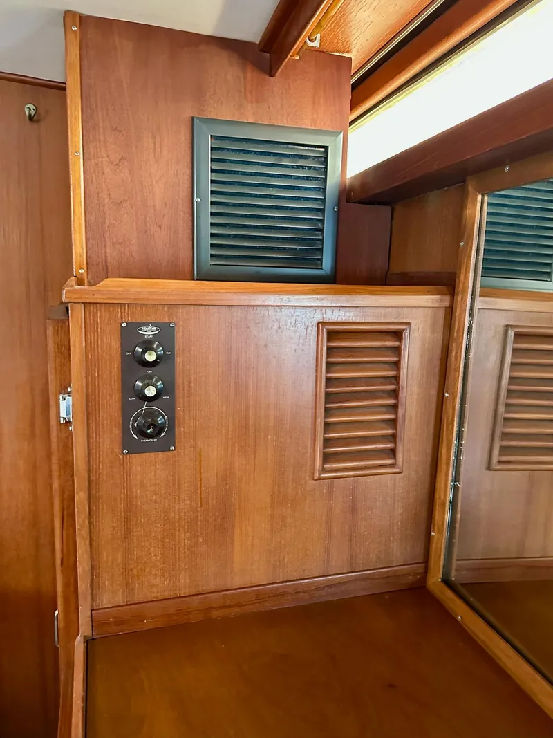 Slide: The Image of 1987 Jefferson Sundeck interior with wooden paneling and control knobs. - 29