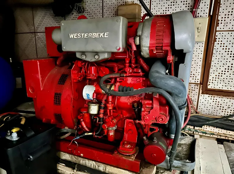 Slide: The Image of Red Westerbeke engine in a 1987 Jefferson Sundeck boat. - 37