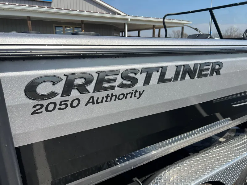 Slide: The Image of Crestliner 2050 Authority 2025 model boat with metallic finish, side view. - 1