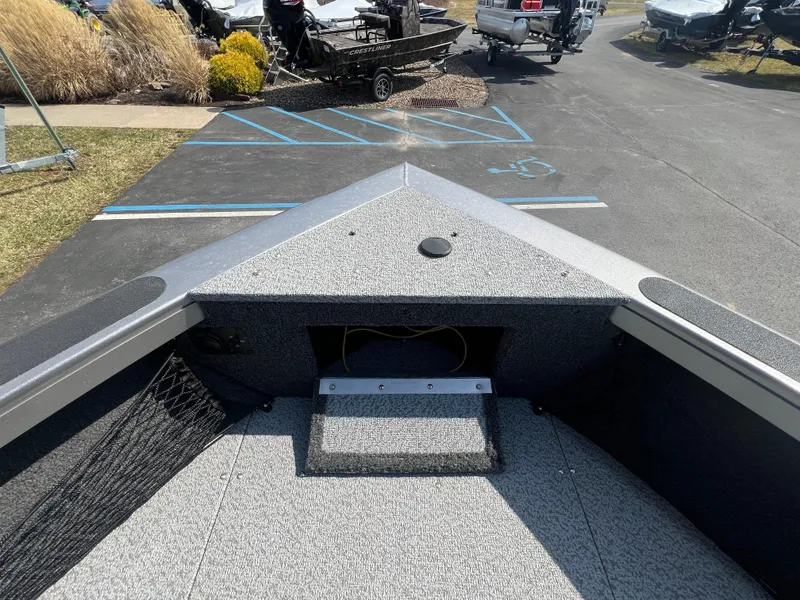 Slide: The Image of 2025 Crestliner 2050 Authority boat interior, showing bow area with storage compartment. - 10