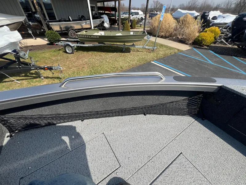 Slide: The Image of 2025 Crestliner 2050 Authority boat interior with storage compartments and outdoor display. - 12