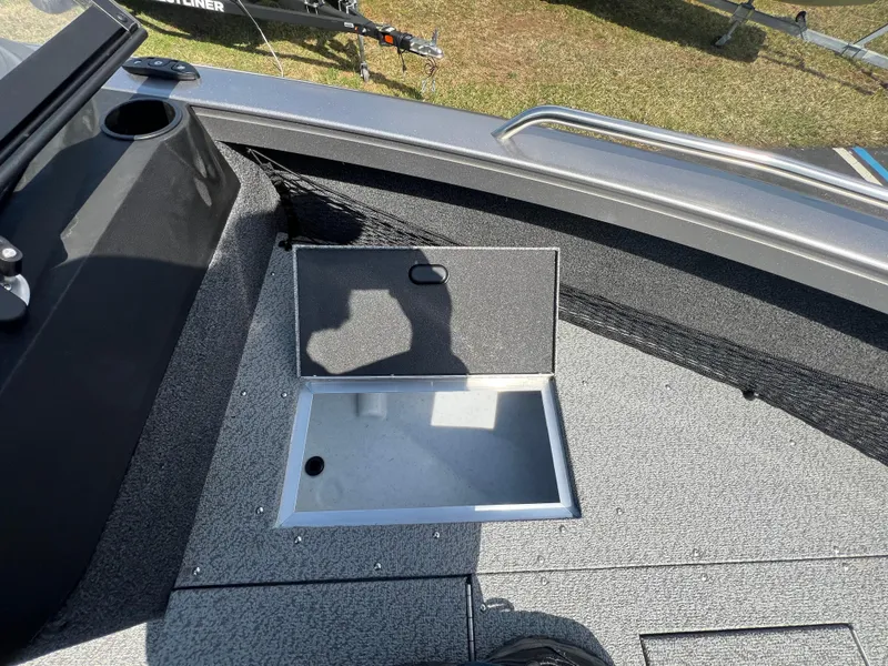 Slide: The Image of Open storage compartment on 2025 Crestliner 2050 Authority boat deck. - 13