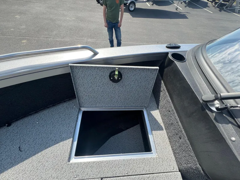 Slide: The Image of Open storage compartment on 2025 Crestliner 2050 Authority boat deck. - 14