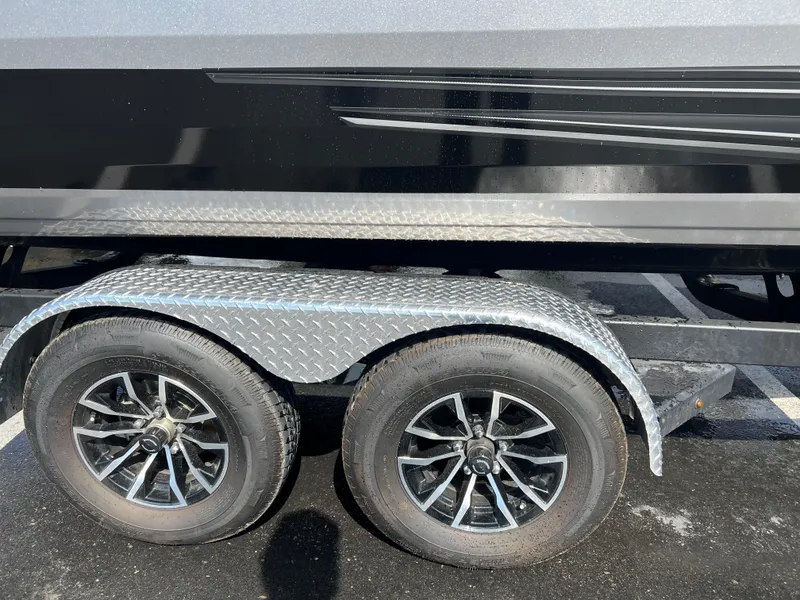 Slide: The Image of Trailer wheels of a 2025 Crestliner 2050 Authority boat on a diamond plate fender. - 3