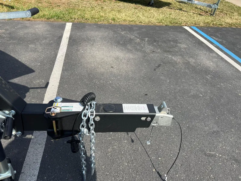 Slide: The Image of Trailer hitch of 2025 Crestliner 2050 Authority boat in parking lot. - 5