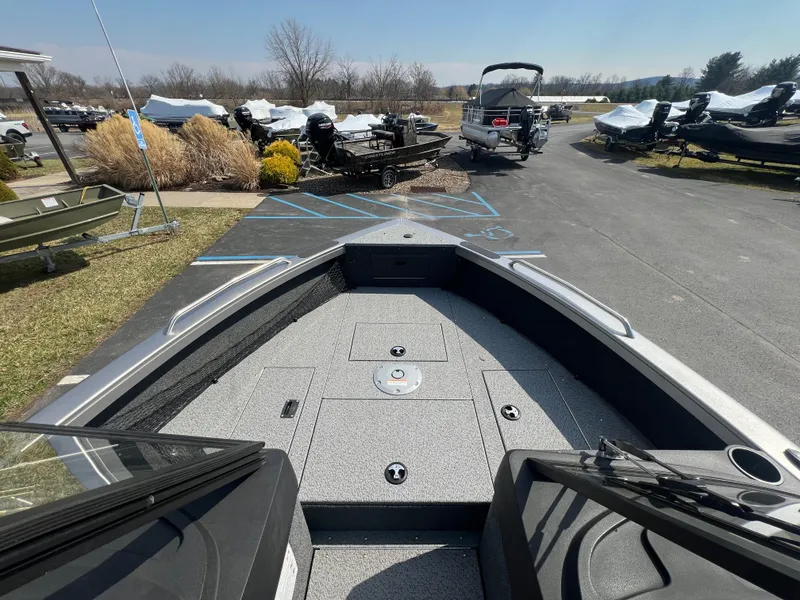 Slide: The Image of 2025 Crestliner 2050 Authority boat, view from the bow, parked outdoors. - 8