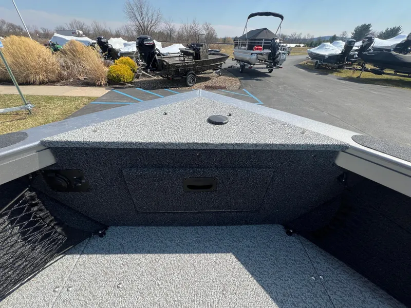 Slide: The Image of 2025 Crestliner 2050 Authority boat interior, showcasing spacious deck and storage area. - 9