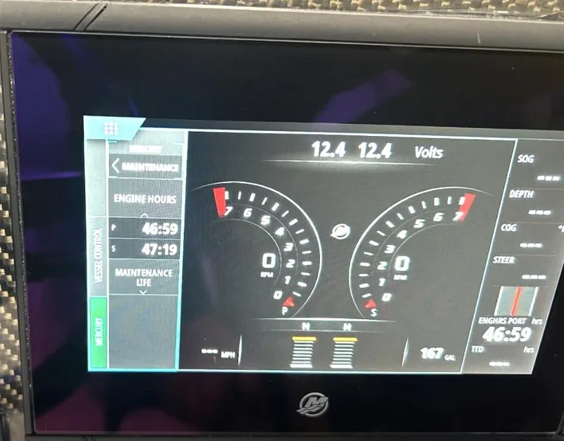 Slide: The Image of Boat dashboard display showing engine hours, voltage, and RPM gauges on Predator C30, 2018 model. - 13