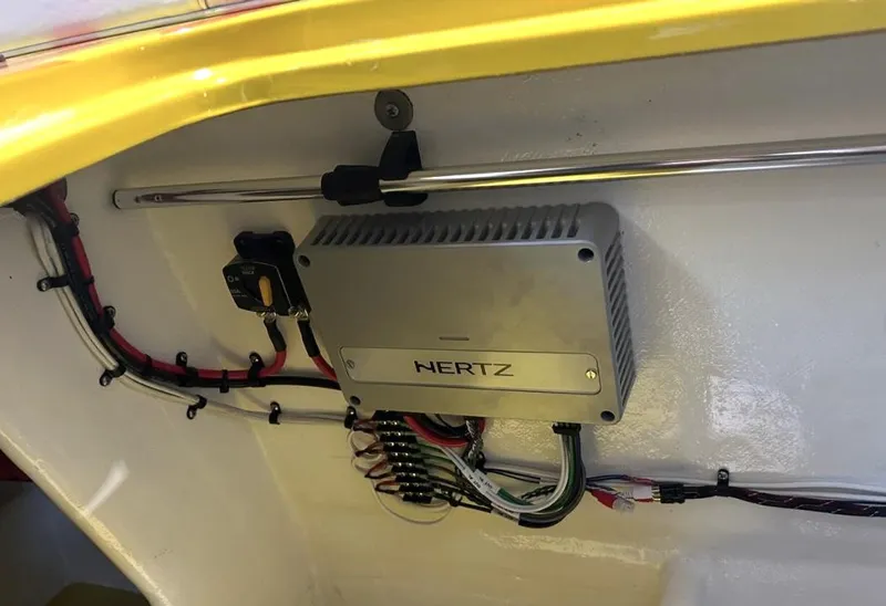 Slide: The Image of Audio amplifier installation in a 2018 Predator C30 boat, featuring Hertz equipment and wiring. - 16