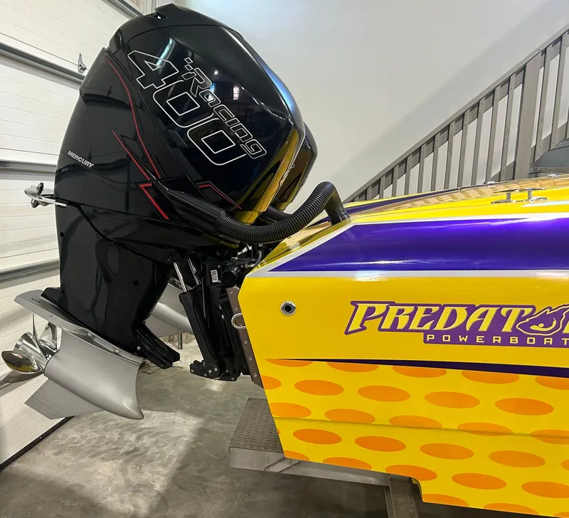 Slide: The Image of 2018 Predator C30 powerboat with Mercury Racing 400 outboard engine, vibrant yellow and purple design. - 6