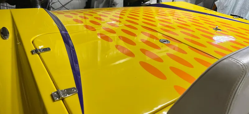 Slide: The Image of Yellow Predator C30 boat with orange dot pattern, 2018 model, featuring sleek design and vibrant colors. - 7