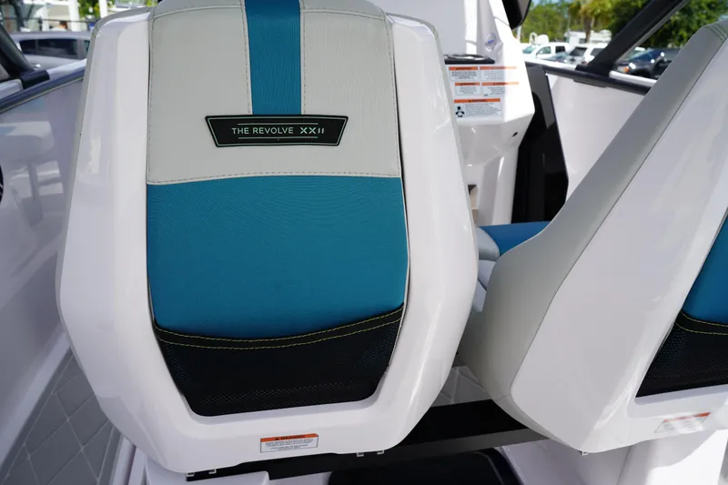 Slide: The Image of 2022 Axopar 22 T-Top boat seat with blue and white upholstery. - 11