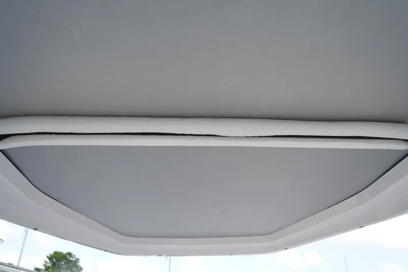 Slide: The Image of 2022 Axopar 22 T-Top boat roof detail, showcasing sleek design and structure. - 22