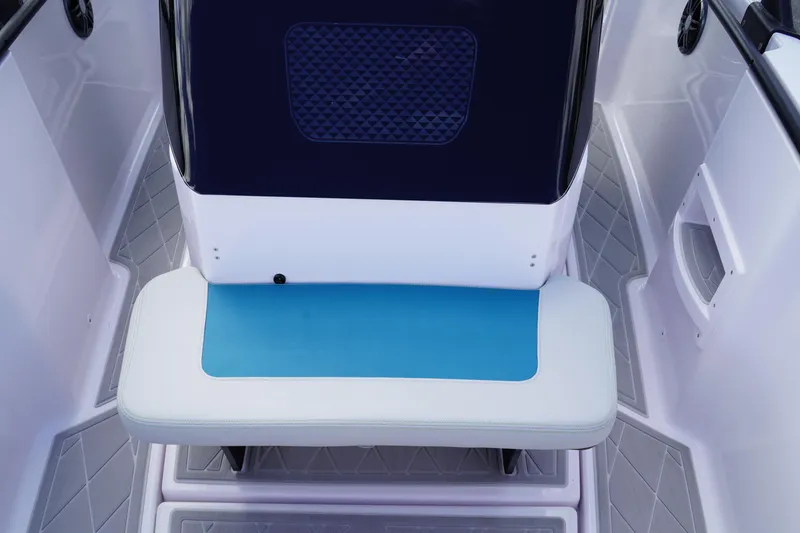 Slide: The Image of 2022 Axopar 22 T-Top boat interior with blue and white seating. - 24