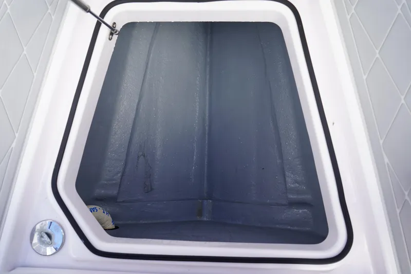 Slide: The Image of Storage compartment of 2022 Axopar 22 T-Top boat, featuring a spacious interior. - 27
