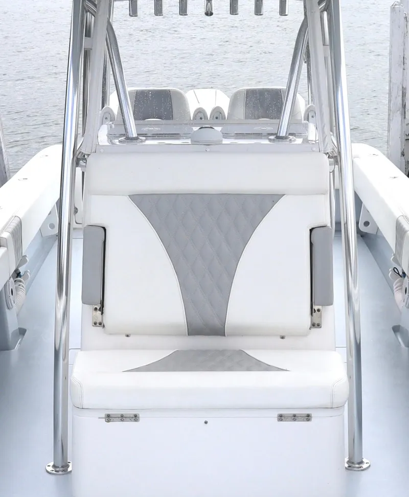 Slide: The Image of 2022 Contender 35 ST boat interior with white and gray seating, sleek design. - 12