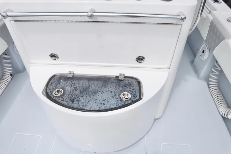 Slide: The Image of 2022 Contender 35 ST boat livewell with water, featuring sleek design and stainless steel hardware. - 13