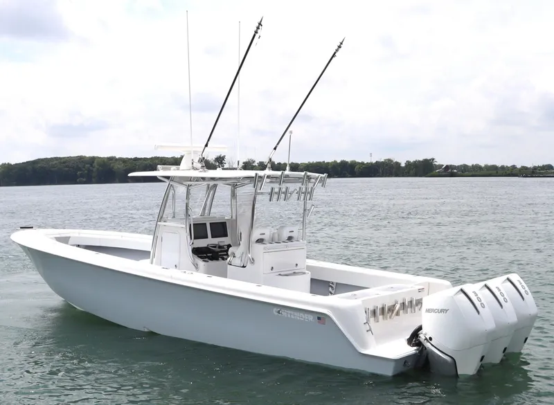 Slide: The Image of 2022 Contender 35 ST boat with triple Mercury engines on calm water. - 6