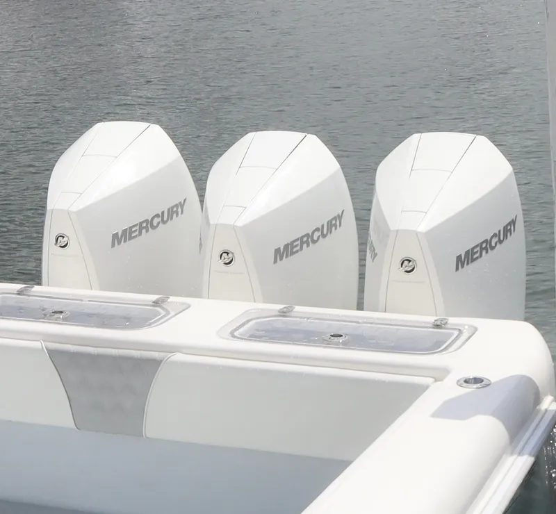Slide: The Image of 2022 Contender 35 ST boat with triple Mercury outboard engines on water. - 8