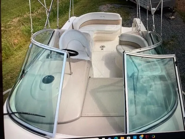 Slide: The Image of 2008 Sea Ray 260 Sundancer boat interior with seating and open windshield. - 5