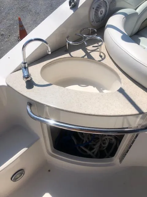 Slide: The Image of 2008 Sea Ray 260 Sundancer boat sink with faucet and cup holders. - 9