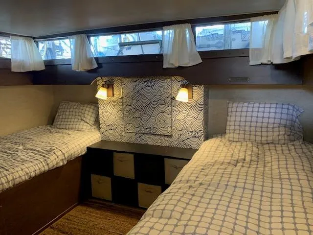 Slide: The Image of 1965 Chris-Craft 460 Constellation cabin with twin beds and nautical decor. - 11