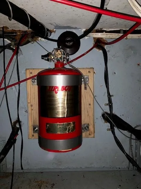 Slide: The Image of Fire extinguisher mounted on a 1965 Chris-Craft 460 Constellation boat. - 14