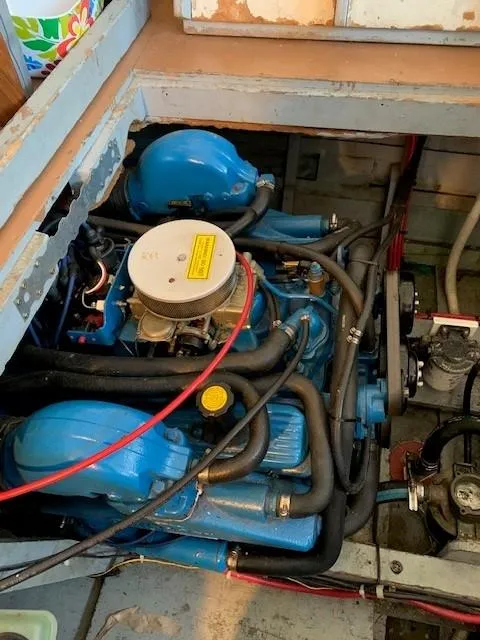 Slide: The Image of Engine compartment of a 1965 Chris-Craft 460 Constellation boat, showcasing blue engine components. - 16