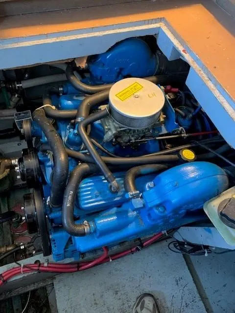 Slide: The Image of Engine of 1965 Chris-Craft 460 Constellation, featuring blue components and intricate piping. - 17