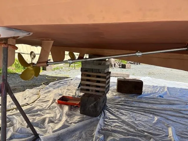 Slide: The Image of 1965 Chris-Craft 460 Constellation boat underbody with propeller and support stands. - 22