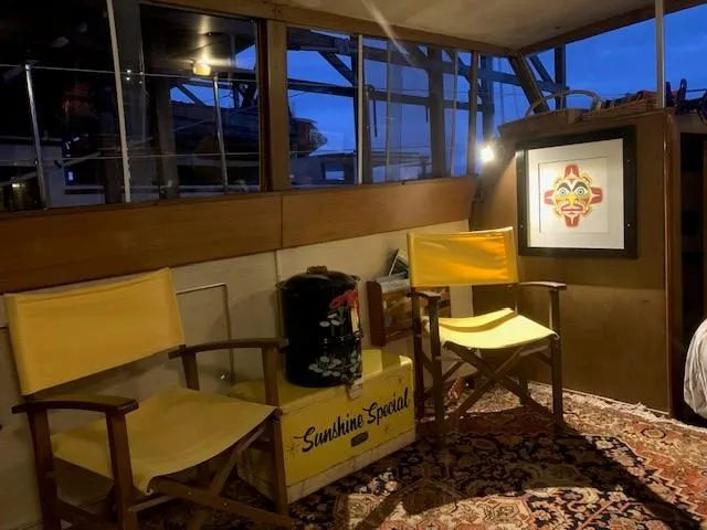 Slide: The Image of Interior of 1965 Chris-Craft 460 Constellation with yellow chairs and decorative artwork. - 7