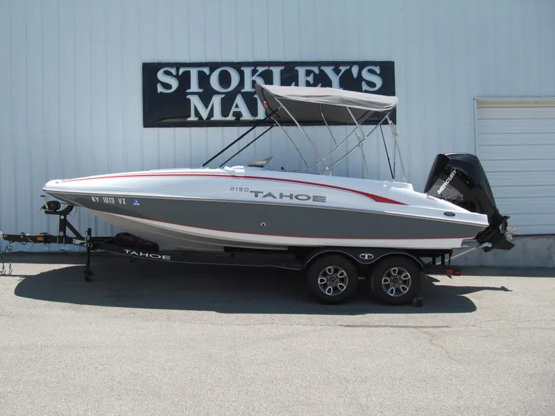 Slide: The Image of 2023 Tahoe 2150 boat on trailer, parked outside Stokley's Marine. - 1
