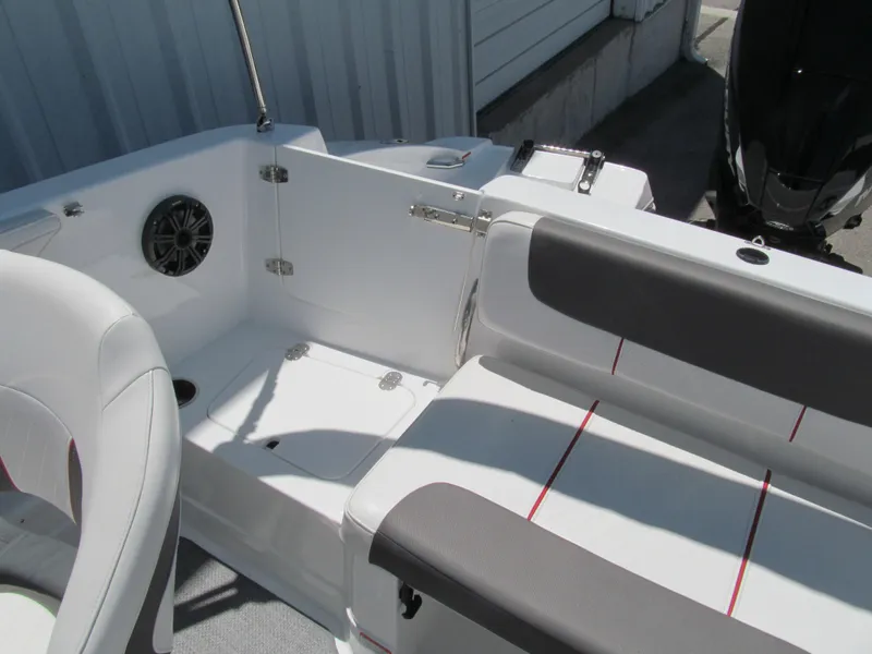 Slide: The Image of 2023 Tahoe 2150 boat interior with seating and speaker, showcasing modern design. - 15