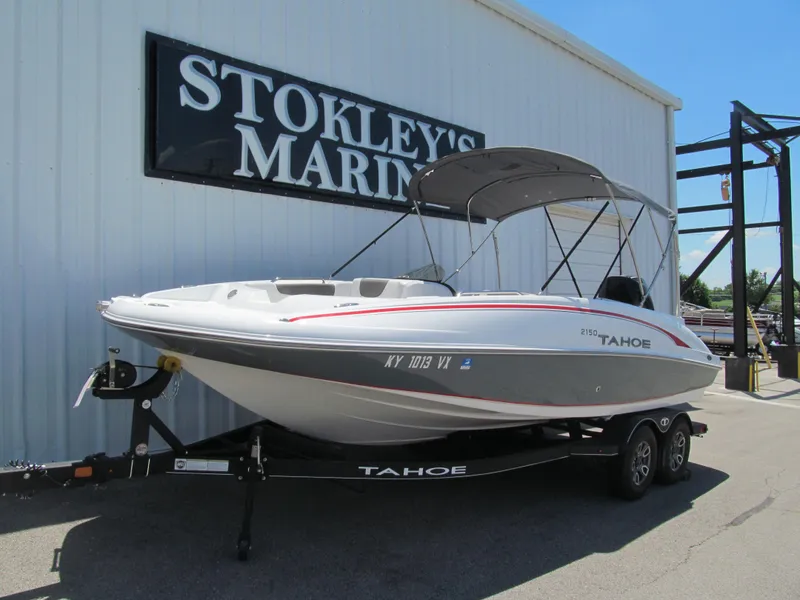 Slide: The Image of 2023 Tahoe 2150 boat on trailer at Stokley's Marine dealership. - 2
