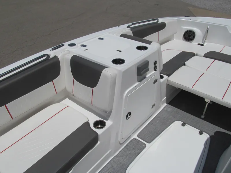 Slide: The Image of 2023 Tahoe 2150 boat interior with cushioned seating and cup holders. - 8