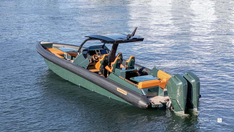 Slide: The Image of 2025 Skipper-BSK 38 boat with dual engines on calm water. - 24