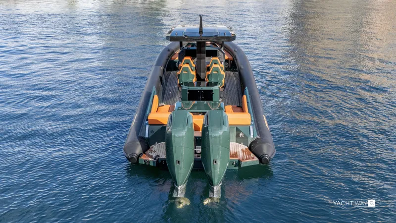 Slide: The Image of Skipper-BSK 38 boat, 2025 model, with dual engines on calm water. - 34