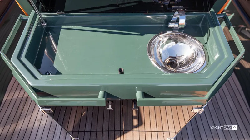 Slide: The Image of Outdoor sink on Skipper-BSK 38 yacht, 2025 model, with green countertop and stainless steel basin. - 41