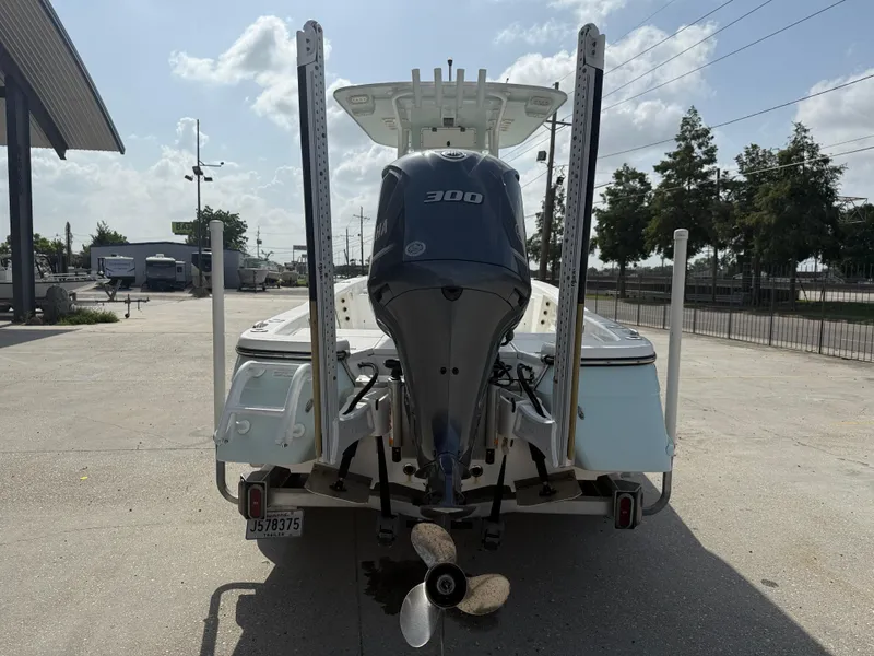 Slide: The Image of 2018 BlackJack 256 boat with Yamaha 300 engine, parked outdoors on a sunny day. - 6