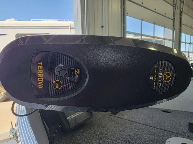 Slide: The Image of 2020 Lund 1600 Fury Tiller with Terrova i-Pilot trolling motor in a garage setting. - 11