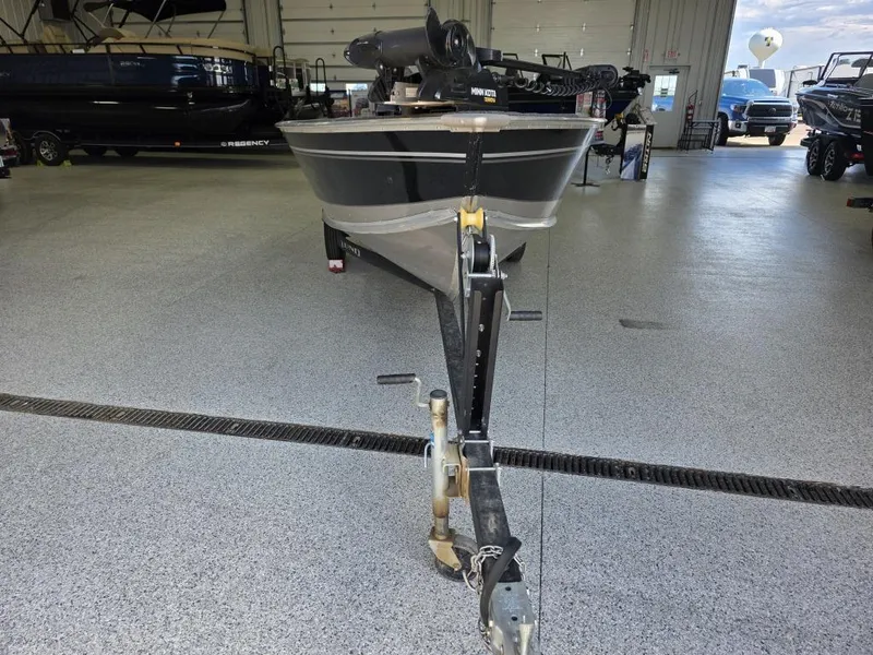 Slide: The Image of 2020 Lund 1600 Fury Tiller boat on trailer in showroom. - 2