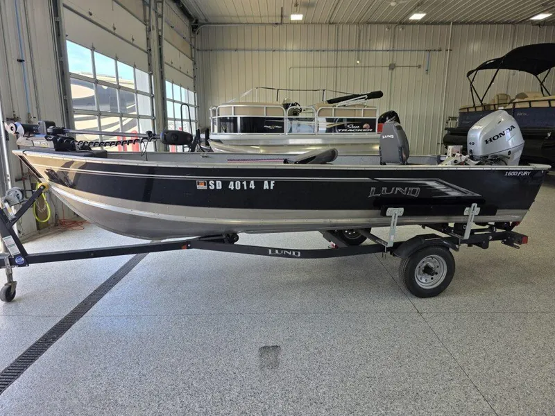 Slide: The Image of 2020 Lund 1600 Fury Tiller boat on trailer in indoor showroom. - 4