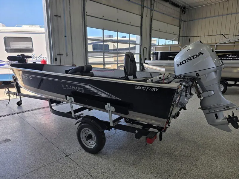 Slide: The Image of 2020 Lund 1600 Fury Tiller boat with Honda outboard motor in a showroom. - 5