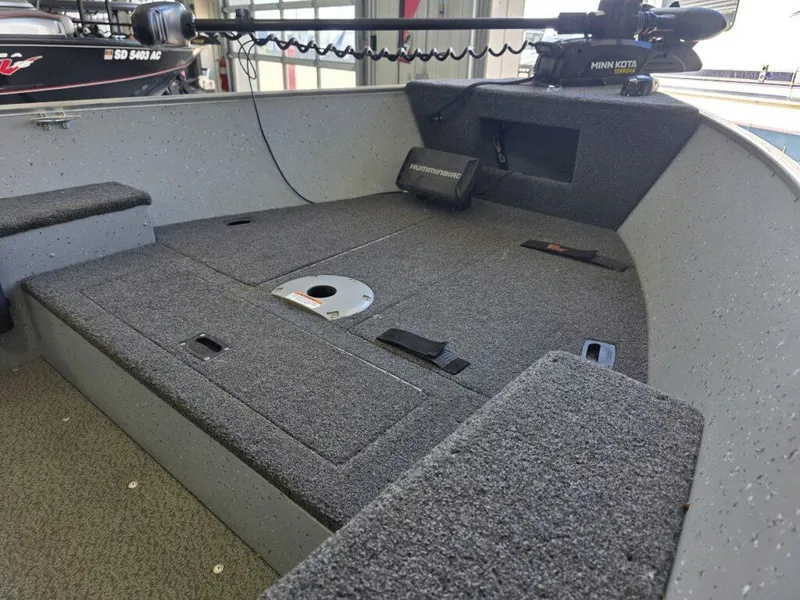 Slide: The Image of 2020 Lund 1600 Fury Tiller boat interior with Minn Kota trolling motor. - 9