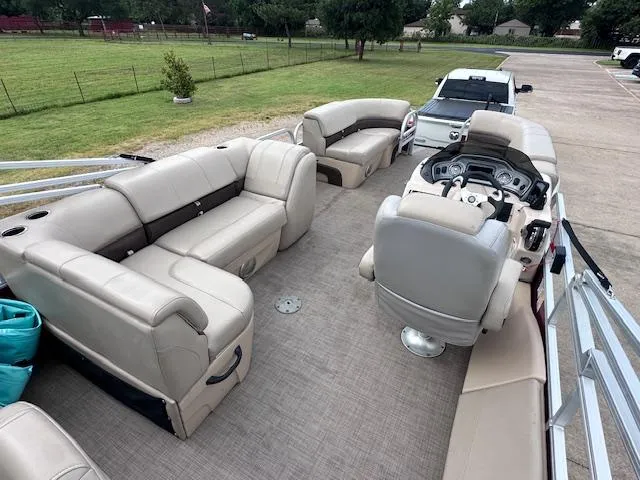 Slide: The Image of 2019 Sun Tracker SportFish 22 DLX pontoon boat with spacious seating and modern dashboard. - 12