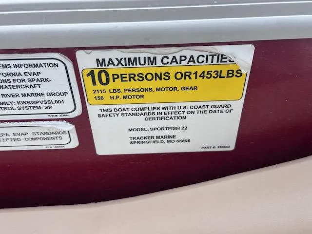 Slide: The Image of 2019 Sun Tracker SportFish 22 DLX capacity label: 10 persons or 1453 lbs, 150 HP motor. - 16